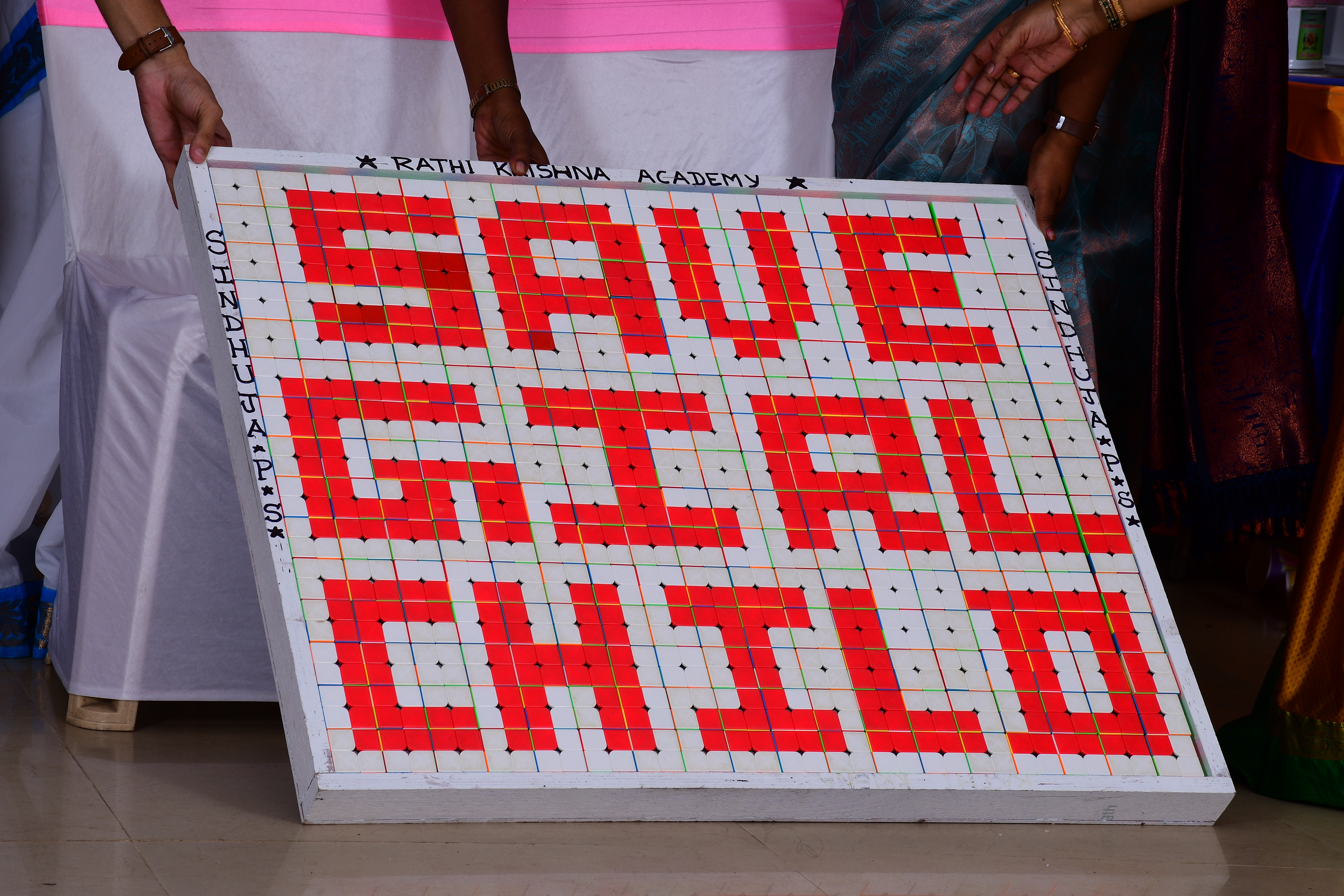 World record by creating a portrait on Save Girl Child by solving 270 number of 2*2 Rubik's Cube in one hand in 40 minutes of time.